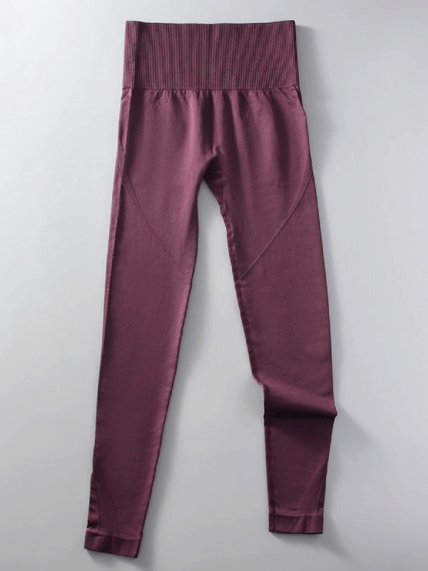 Women's seamless high waist yoga leggings in plum color, full length with elastic waist, made from nylon and spandex for flexibility